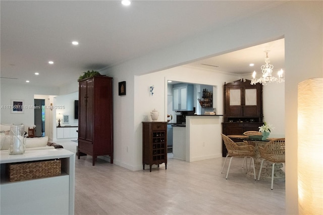 interior space with baseboards, ornamental molding, and recessed lighting