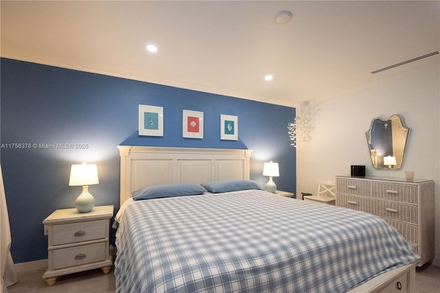 bedroom with baseboards, crown molding, and recessed lighting