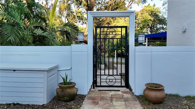 exterior space featuring a gate