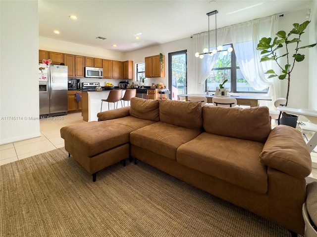 686 NE 191st Ter, Miami, FL 33179 - living room with light tile patterned floors and recessed lighting