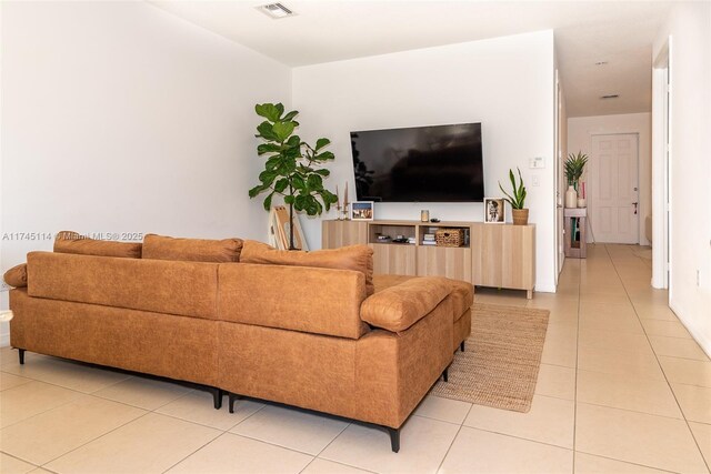 686 NE 191st Ter, Miami, FL 33179 - living room featuring light tile patterned floors