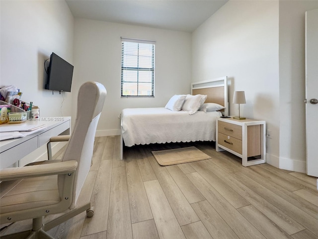 686 NE 191st Ter, Miami, FL 33179 - bedroom featuring light wood-type flooring and baseboards