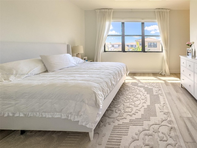 686 NE 191st Ter, Miami, FL 33179 - bedroom with light wood-style floors