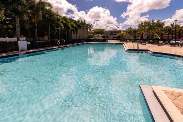 686 NE 191st Ter, Miami, FL 33179 - community pool featuring fence and a patio