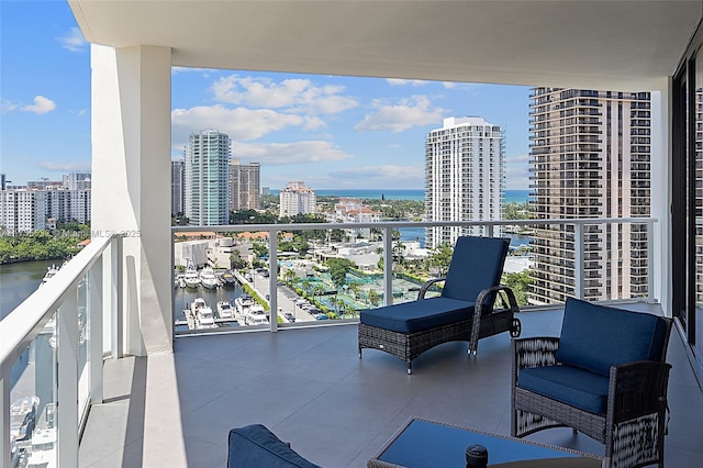 balcony with a view of city and a water view