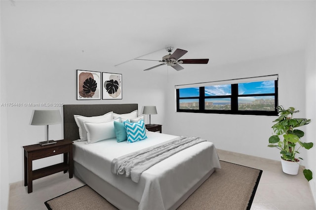 tiled bedroom with a ceiling fan