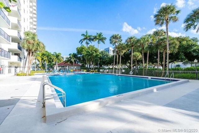 community pool featuring fence