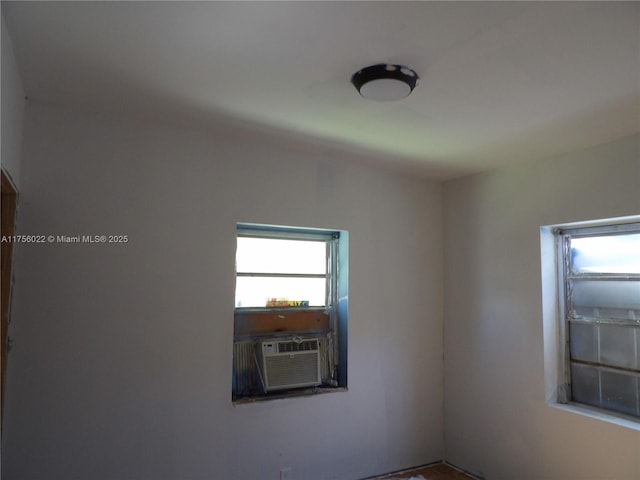 unfurnished room with cooling unit