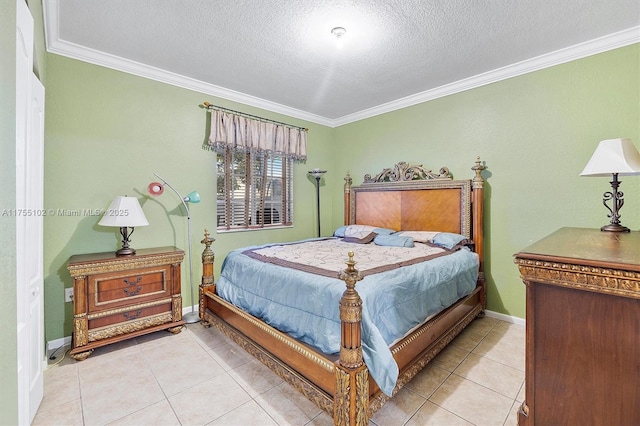 bedroom with ornamental molding, light tile patterned flooring, and a textured ceiling