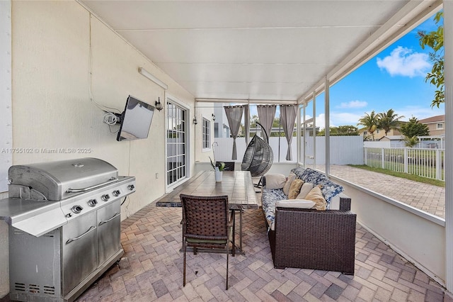 view of patio / terrace featuring fence, an outdoor living space, and area for grilling