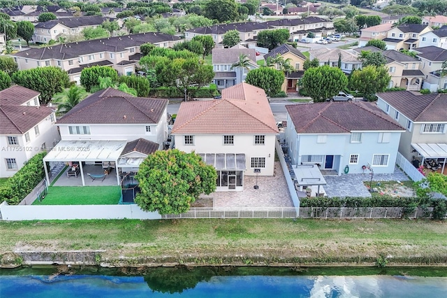 bird's eye view featuring a residential view and a water view