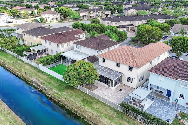 bird's eye view featuring a water view and a residential view