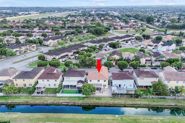 aerial view with a residential view and a water view