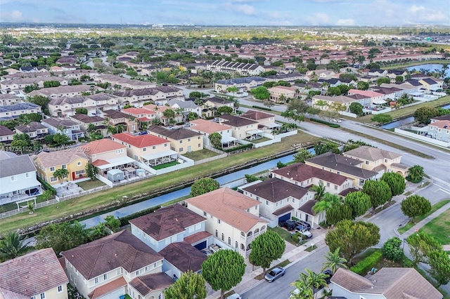 bird's eye view with a water view and a residential view