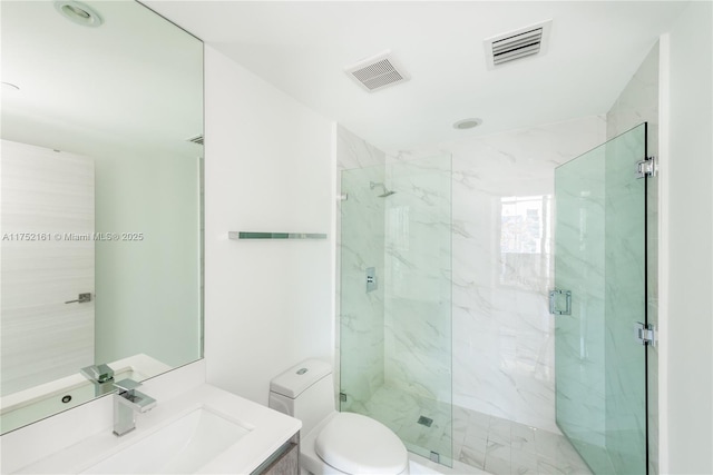 bathroom with toilet, vanity, a marble finish shower, and visible vents