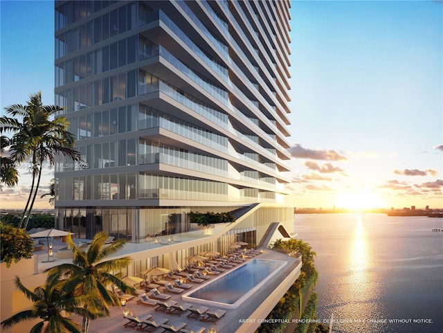 interior space featuring a water view and floor to ceiling windows