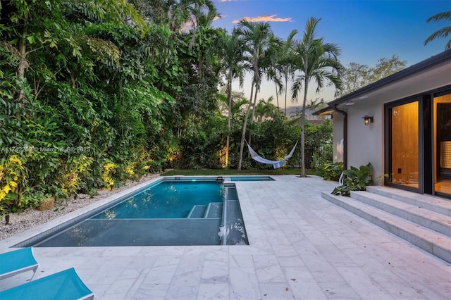 outdoor pool with a patio