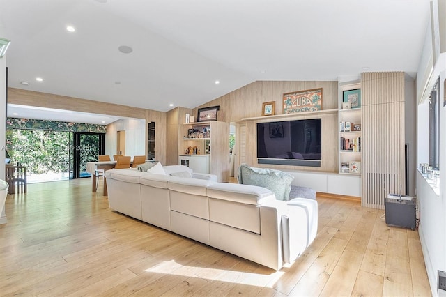 living room with lofted ceiling, hardwood / wood-style floors, and recessed lighting