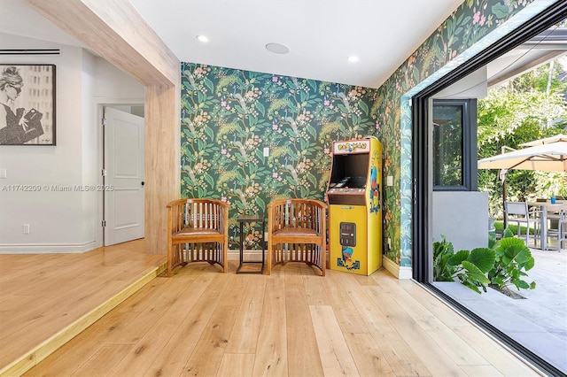 unfurnished room featuring recessed lighting, baseboards, hardwood / wood-style floors, and wallpapered walls