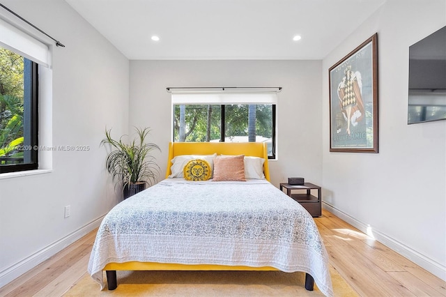 bedroom featuring recessed lighting, wood finished floors, and baseboards