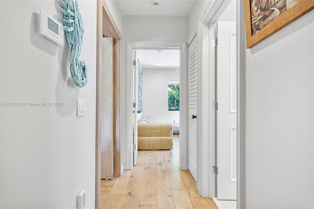 hallway featuring light wood-type flooring