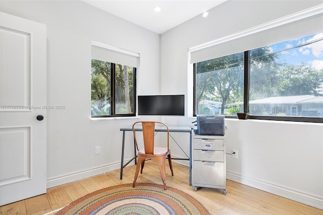 office with wood-type flooring and baseboards