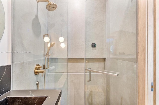 bathroom featuring a shower stall