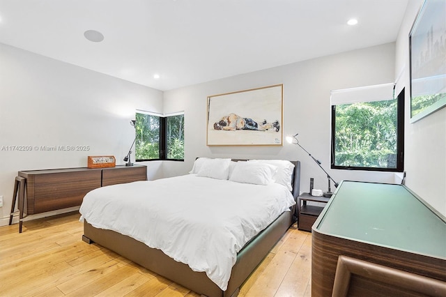 bedroom with light wood-style flooring and recessed lighting