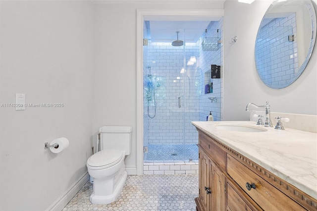 full bathroom with baseboards, toilet, tile patterned flooring, vanity, and a shower stall