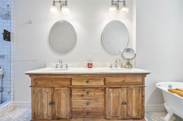 full bath featuring a tile shower, a soaking tub, a sink, and baseboards