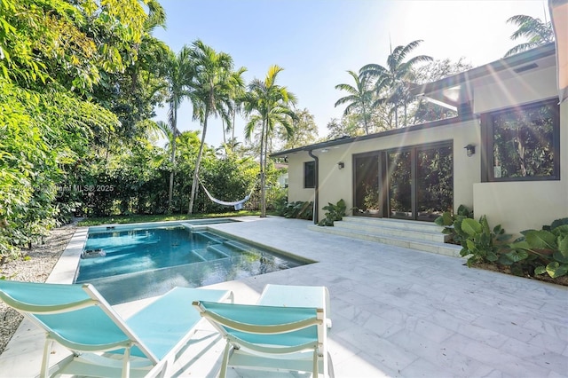 pool with a patio area