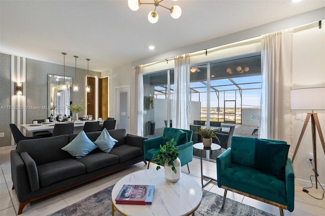 living room with tile patterned flooring, a sunroom, and baseboards