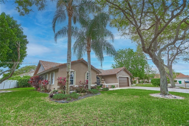 ranch-style house with stucco siding, an attached garage, fence, driveway, and a front lawn