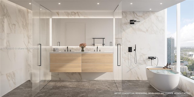 bathroom with marble finish floor, a freestanding bath, a marble finish shower, and double vanity