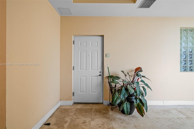 interior space with visible vents and baseboards