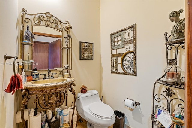 bathroom featuring toilet and vanity