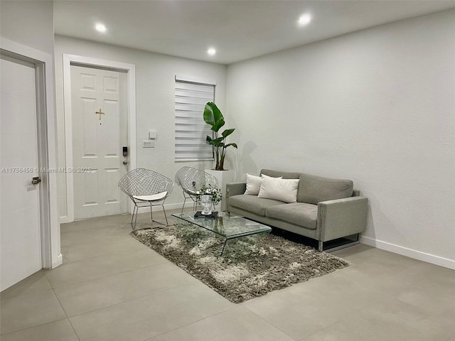 living room with recessed lighting and baseboards