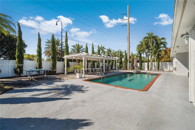 view of swimming pool with a fenced in pool, a patio area, a pergola, and a fenced backyard