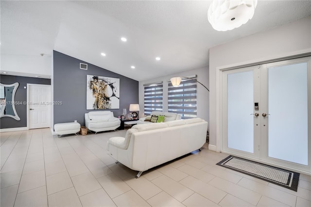 living room with visible vents, baseboards, lofted ceiling, recessed lighting, and a textured ceiling