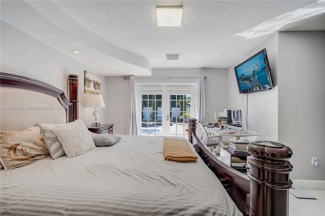 bedroom featuring french doors, baseboards, visible vents, and access to exterior