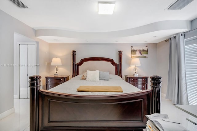 bedroom with visible vents and baseboards