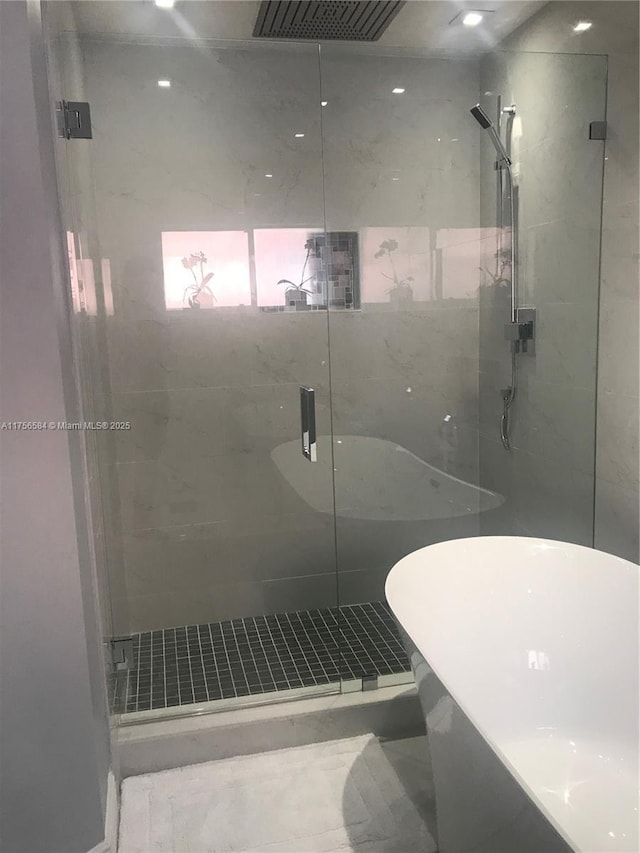 bathroom featuring visible vents and a stall shower