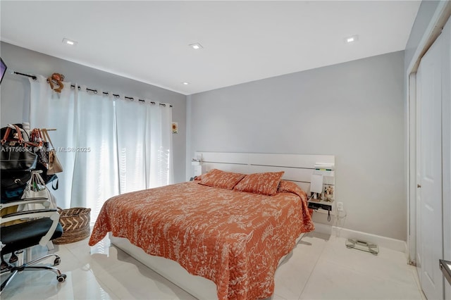 bedroom with recessed lighting, a closet, baseboards, and light tile patterned flooring
