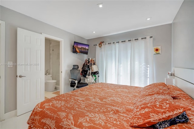bedroom with recessed lighting and ensuite bath