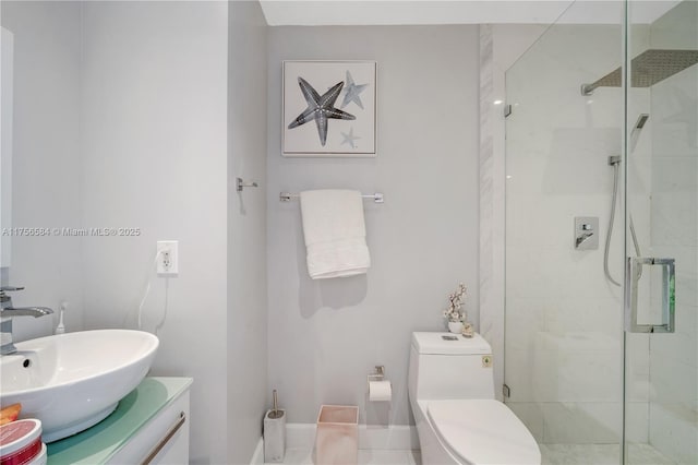 bathroom with toilet, a stall shower, and vanity