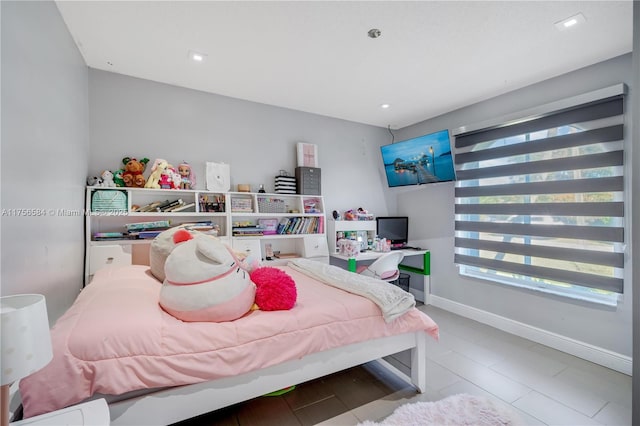 bedroom featuring recessed lighting and baseboards