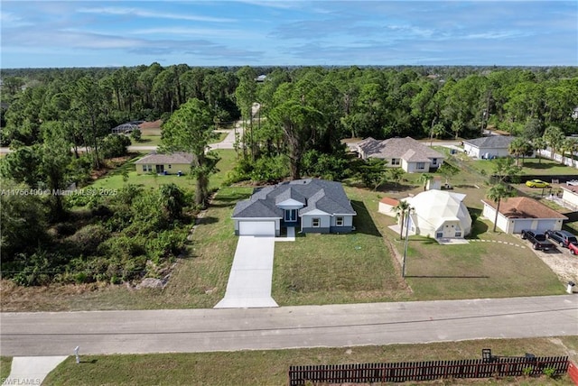 bird's eye view featuring a forest view