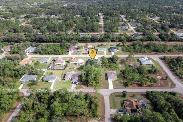 birds eye view of property with a residential view