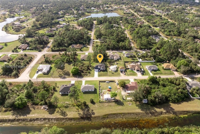 aerial view with a water view and a residential view