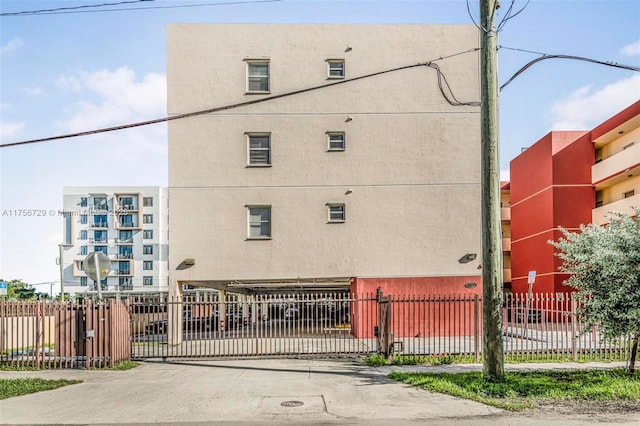 view of property with fence